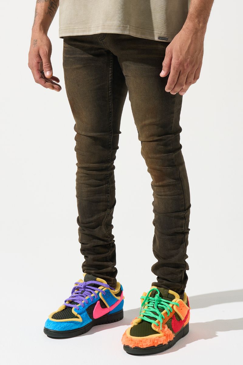 SERENEDE® Cortado fitted jeans in espresso brown denim with subtle fading, elongated inseam, and branded detailing.