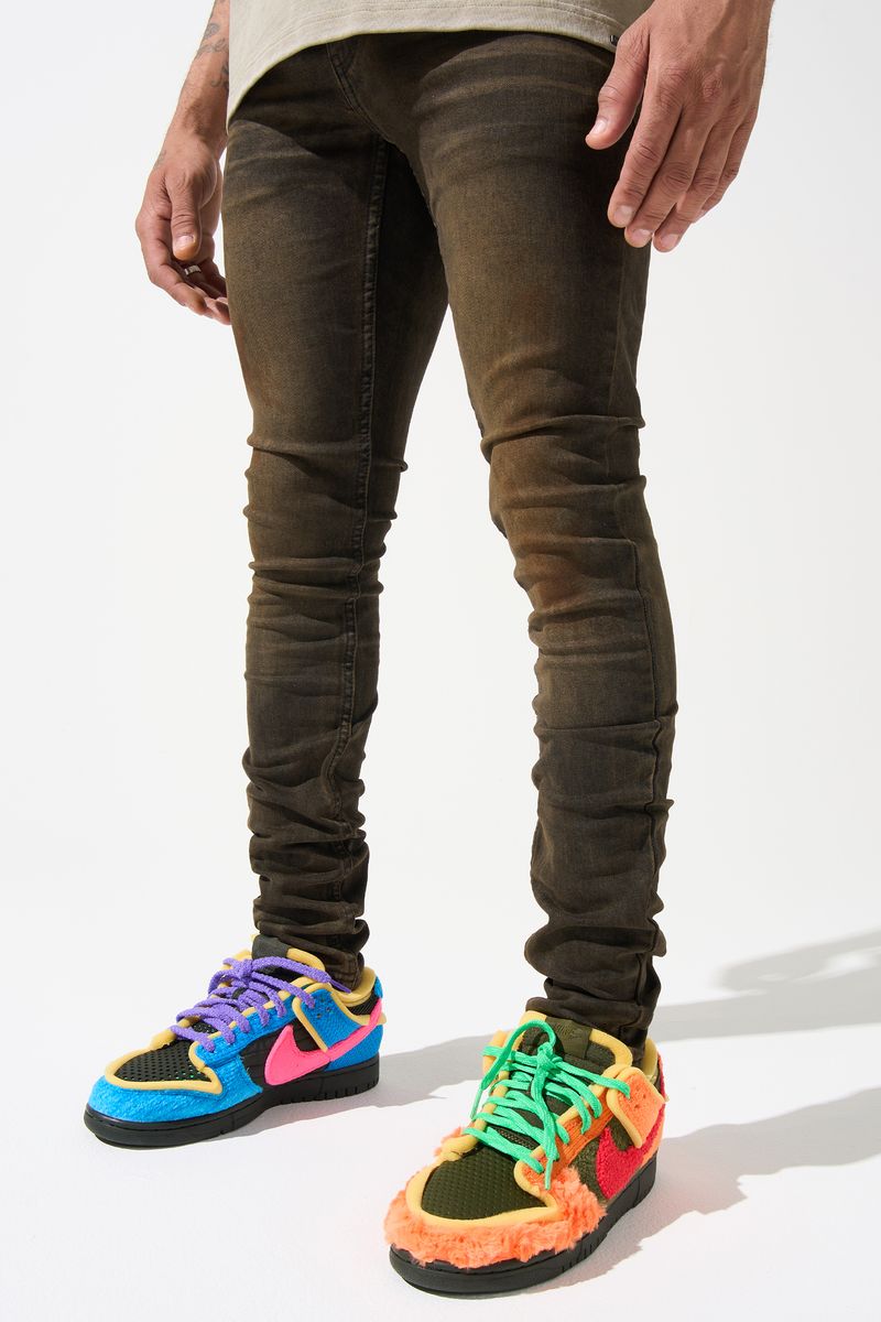 SERENEDE® Cortado fitted jeans in espresso brown denim with subtle fading, elongated inseam, and branded detailing.