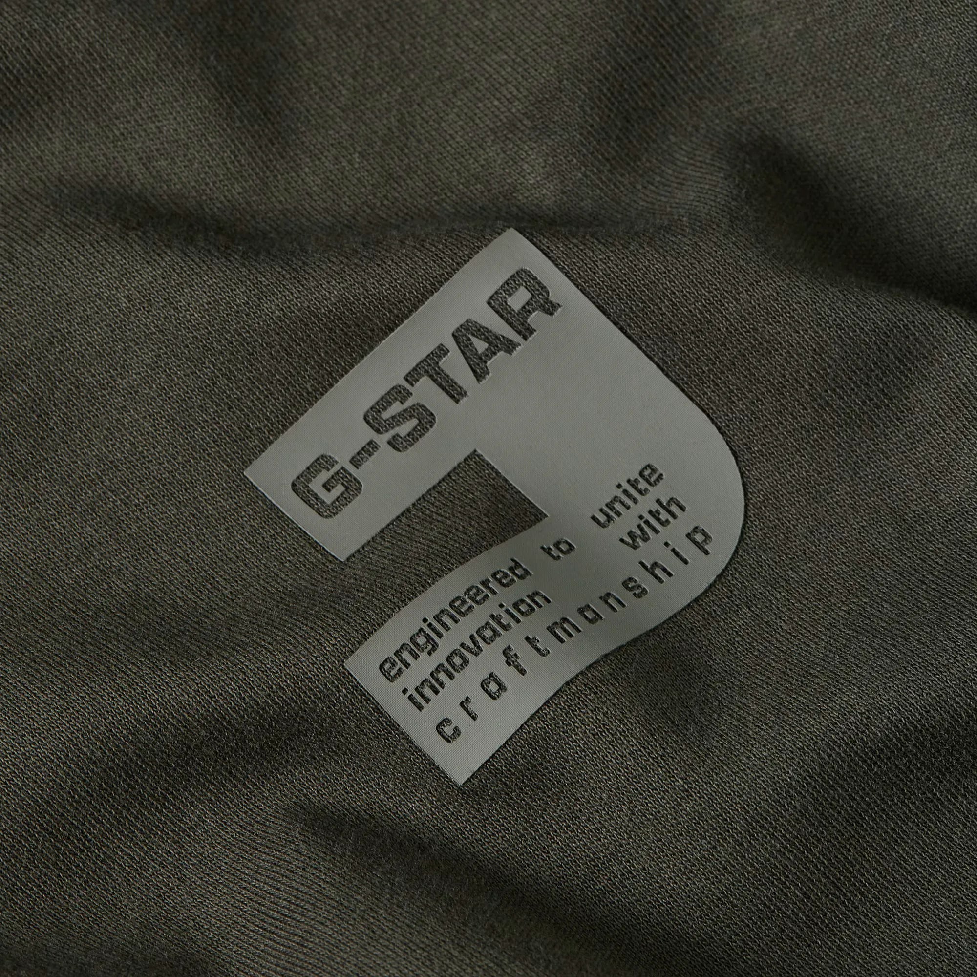 G-Star label on a dark fabric background