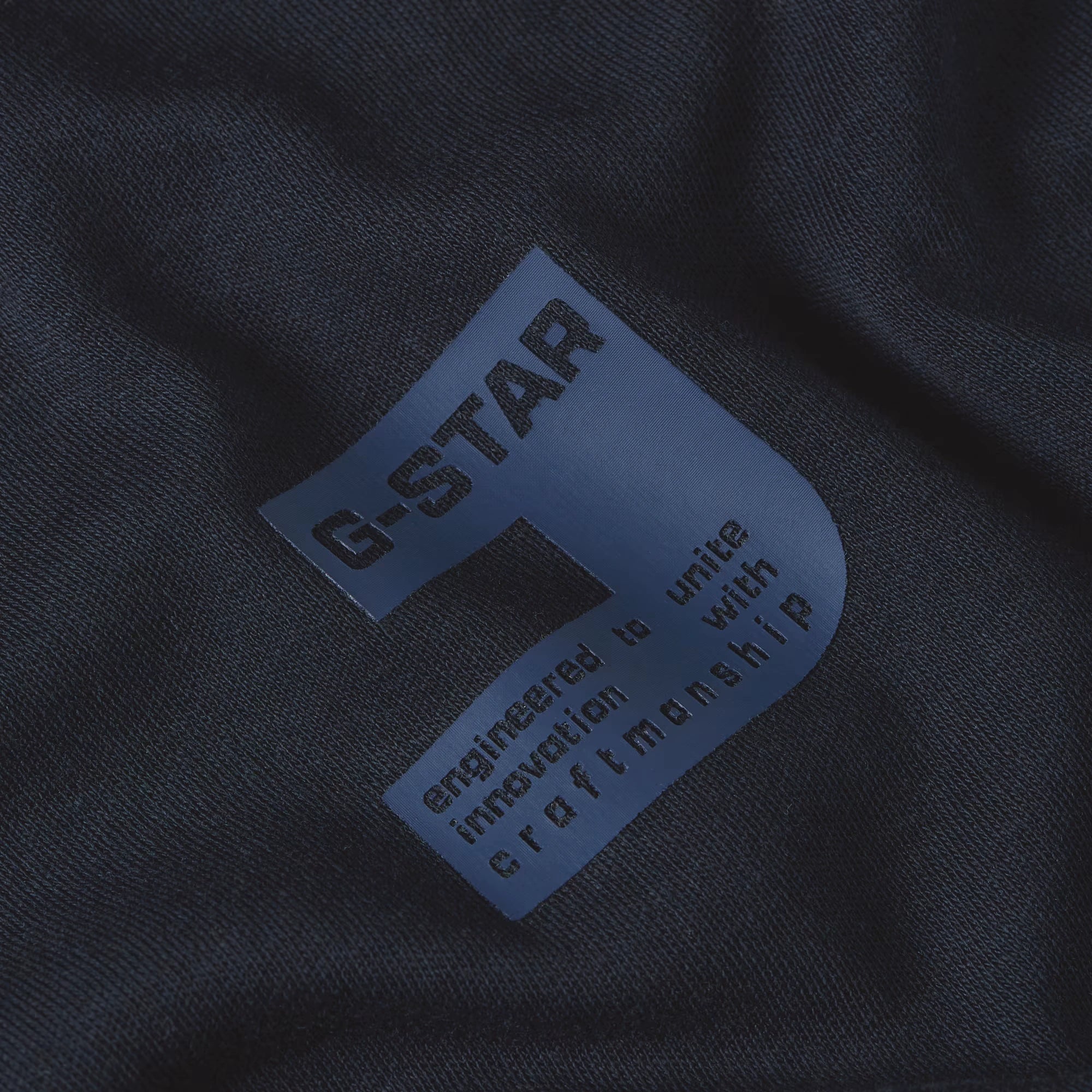 G-Star label on a dark fabric background