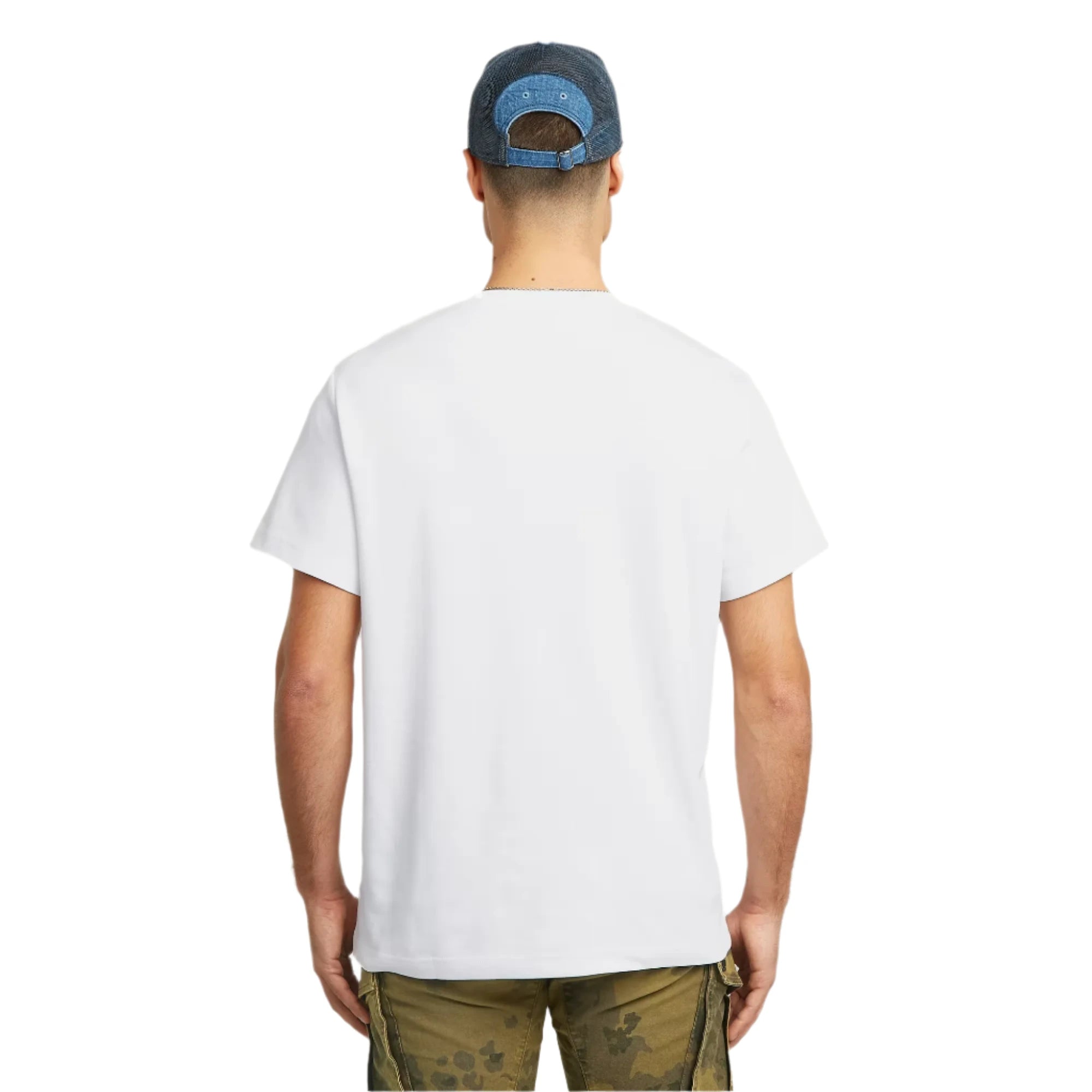 Person wearing a white t-shirt and green pants with a blue cap on a plain background