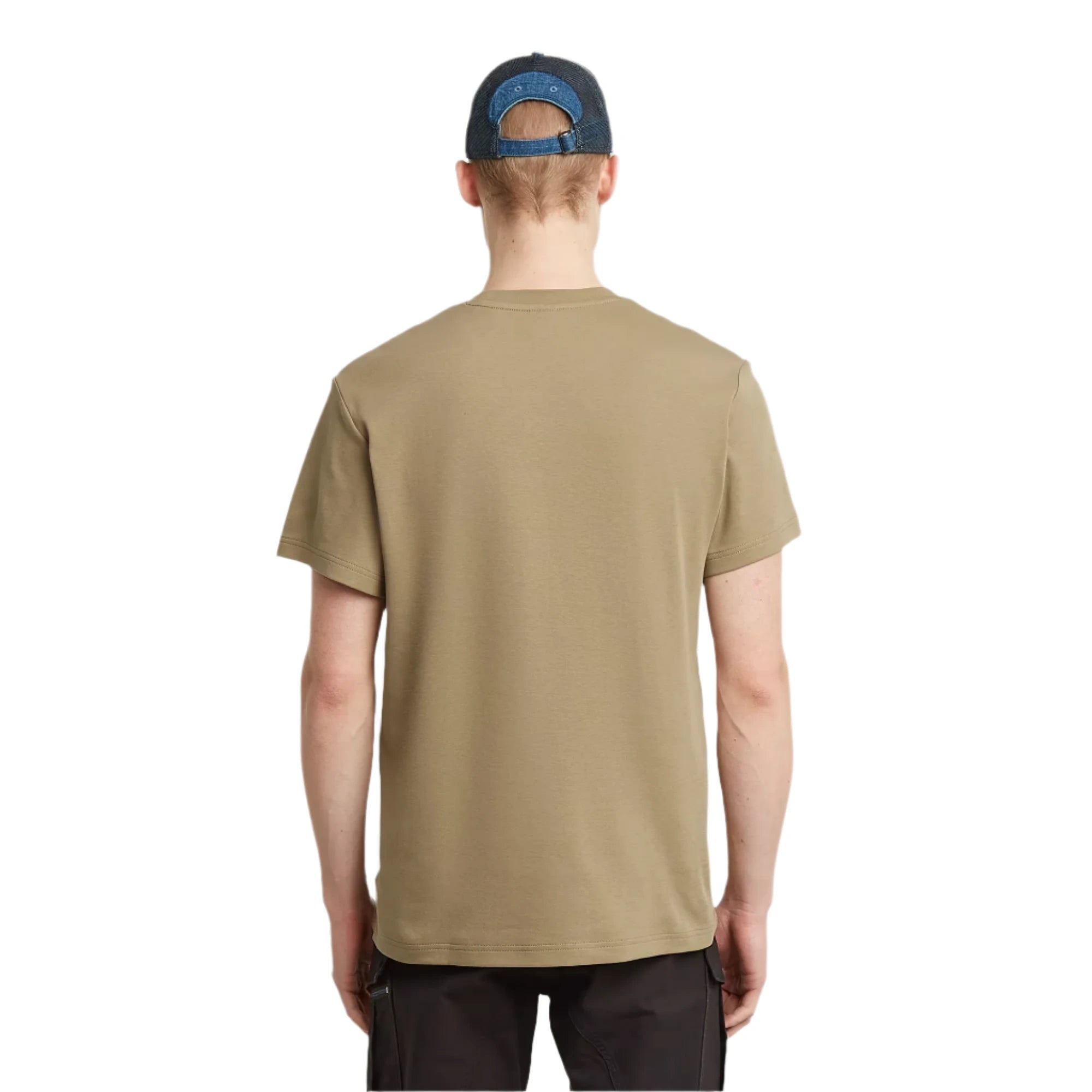 Person wearing a beige t-shirt and dark cap on a plain background