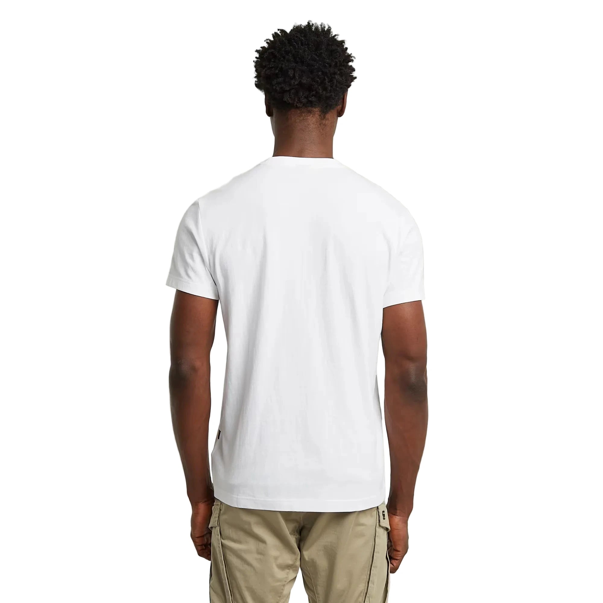 Person wearing a plain white t-shirt on a light gray background