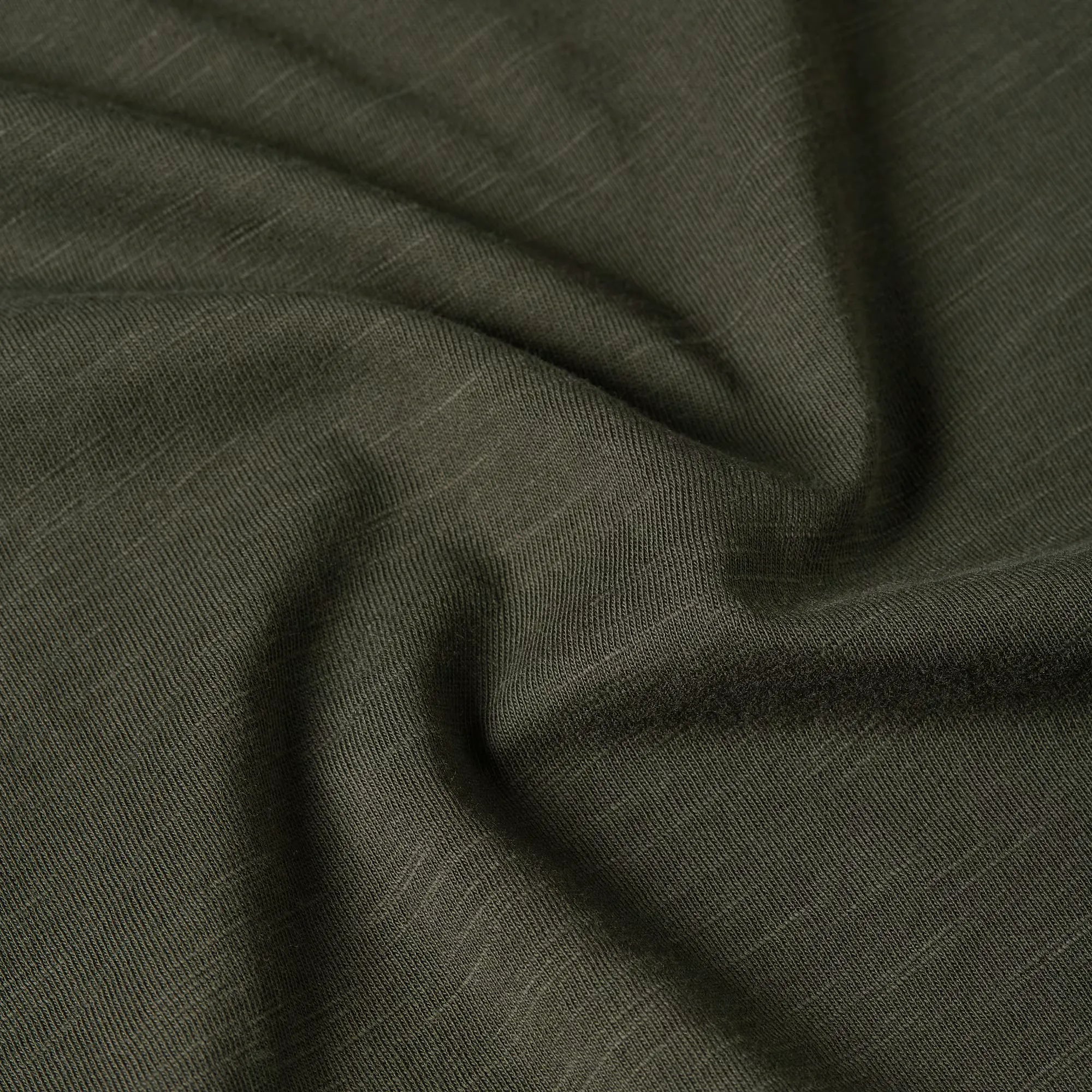 Purveyors T-shirt in asfalt color with a round neck and graphic detail on the front.