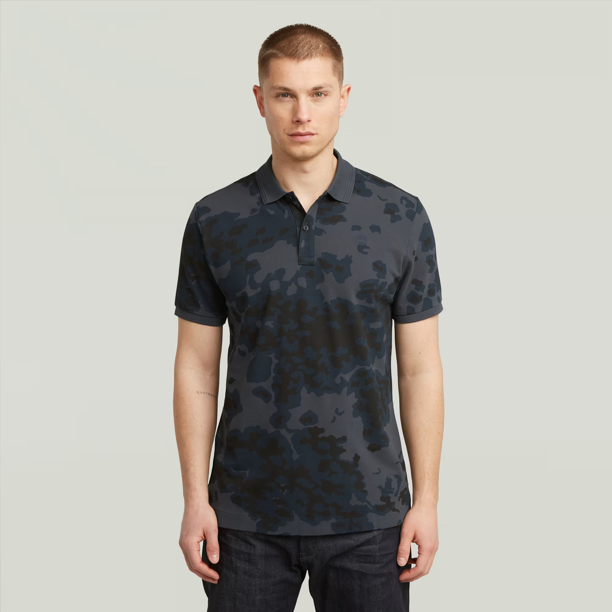 G-STAR® Dunda Slim Allover Polo in India Ink Forest Camo with graphic print and polo collar