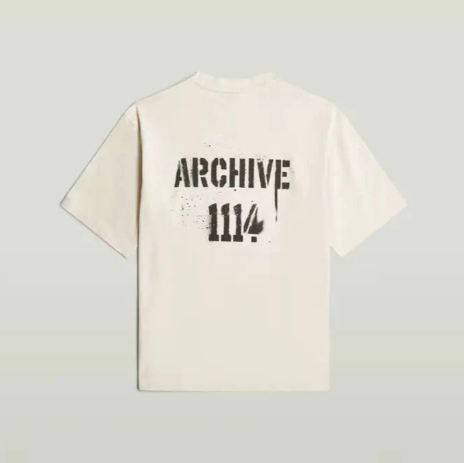 Beige t-shirt with black text on a light gray background