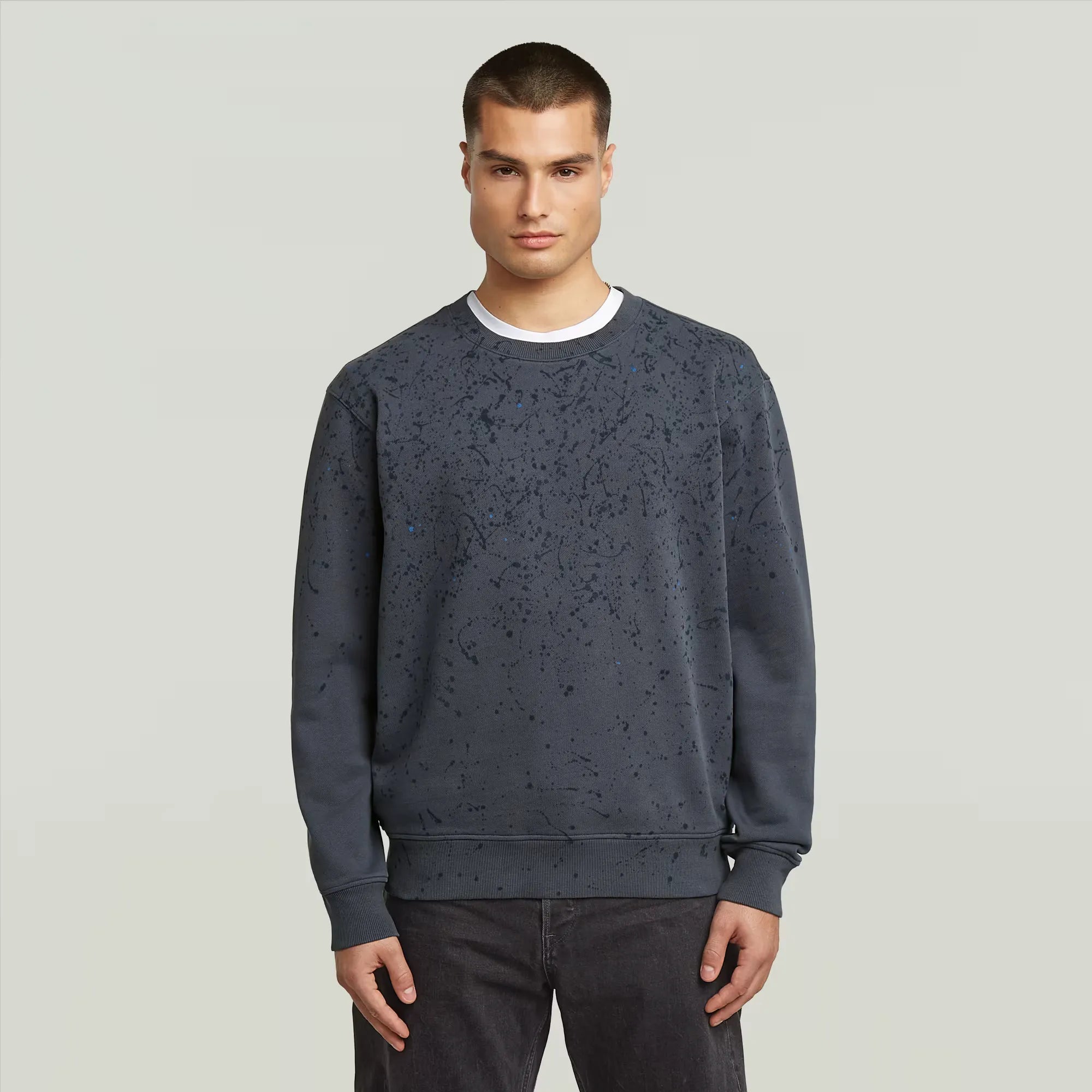 Paint Splatter Relaxed Sweater in India Ink with artistic paint splatter design.