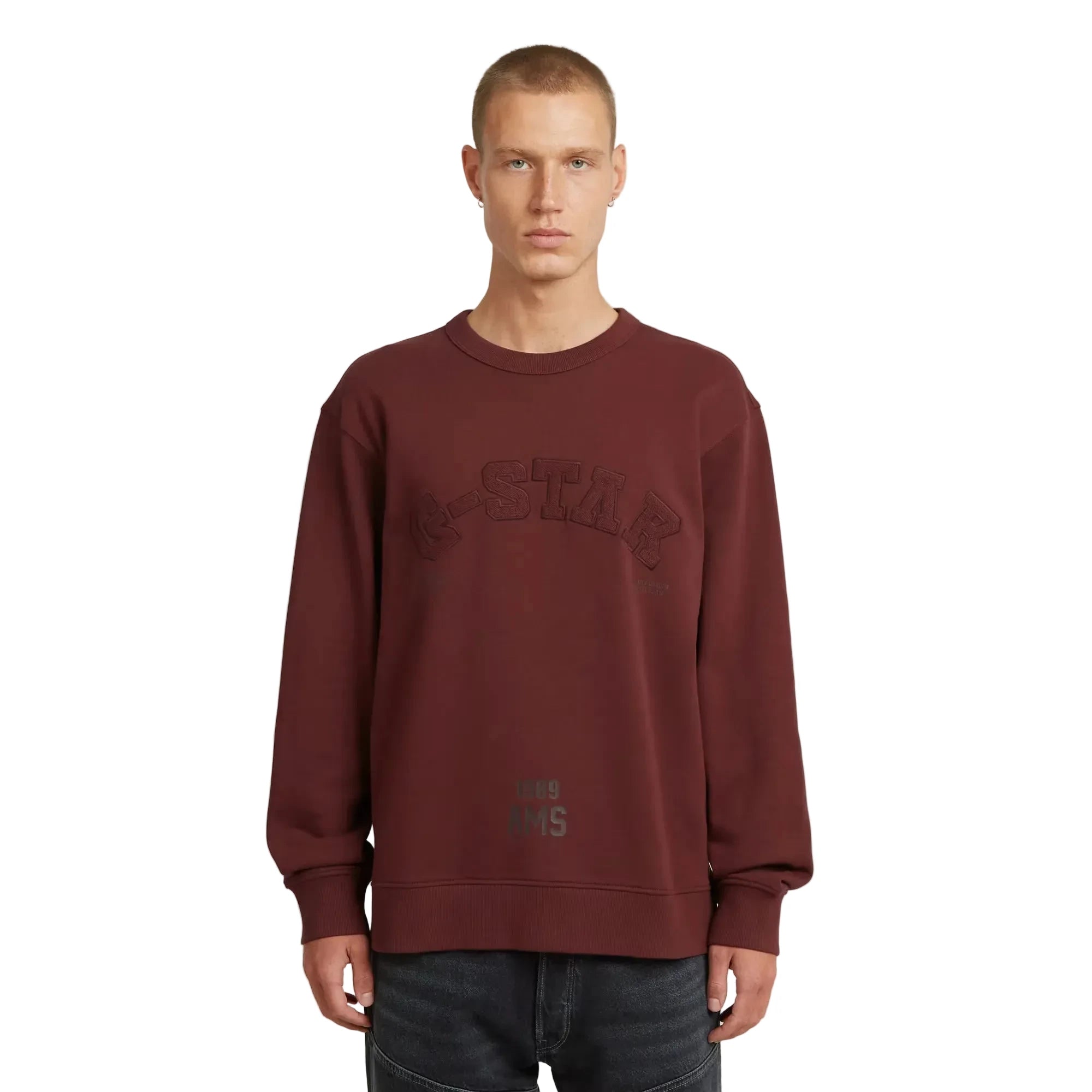 Applique sweater in port red with a round neck and graphic design.