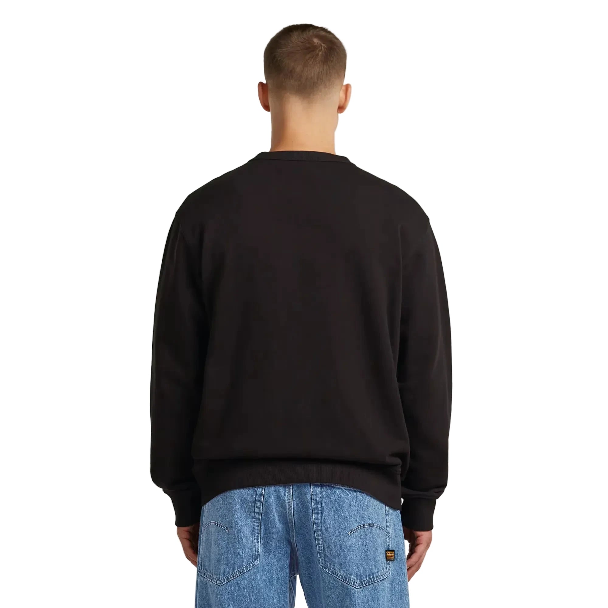 Applique sweater in dark black with a chest applique graphic and ribbed cuffs and hem.