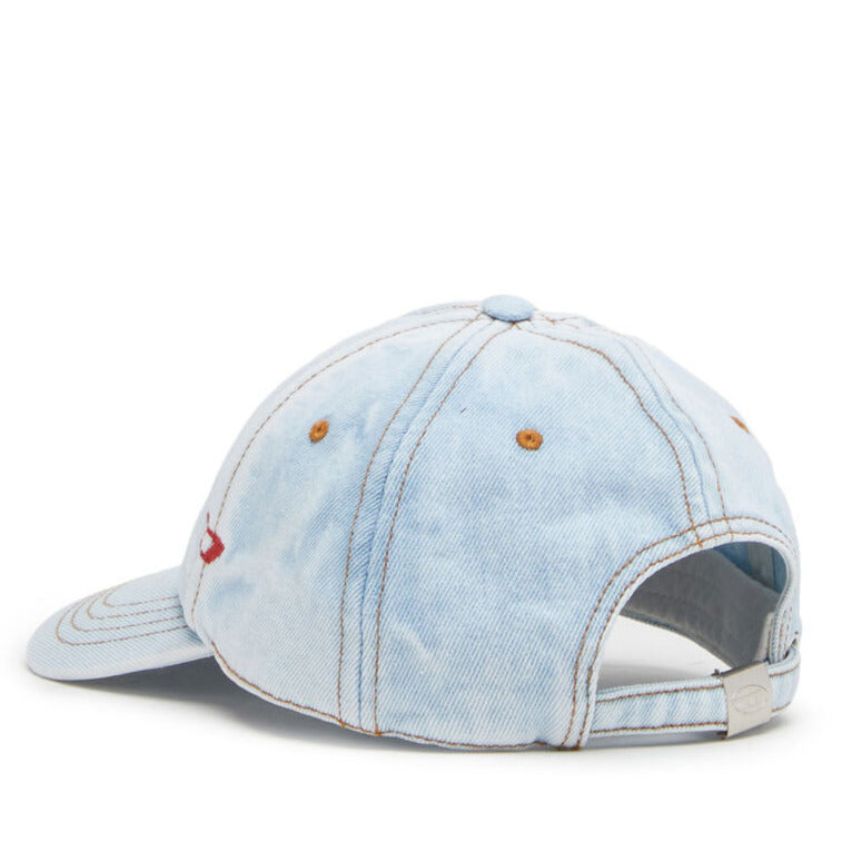 light blue diesel denim baseball cap with red d embroidery and tobacco stitching laid flat