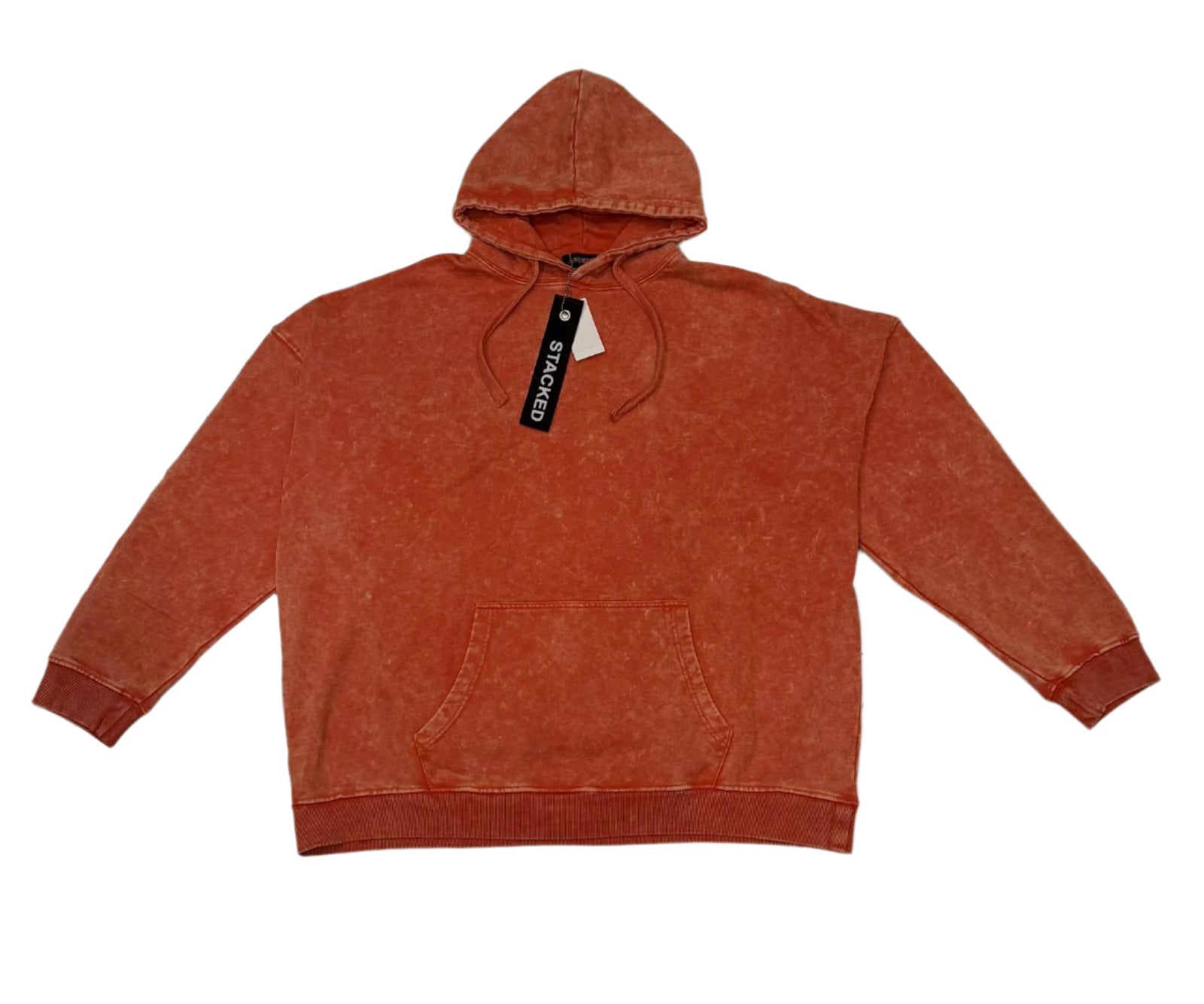 Orange hoodie with a brand tag on a marble floor
