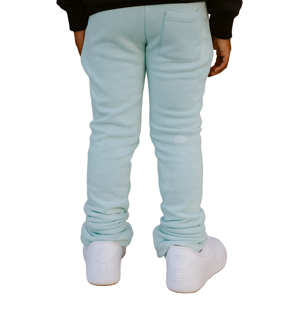 Bring vibrant street style to your kid’s wardrobe with our Kids Tie Dye Stacked Pants in Tiffany Blue