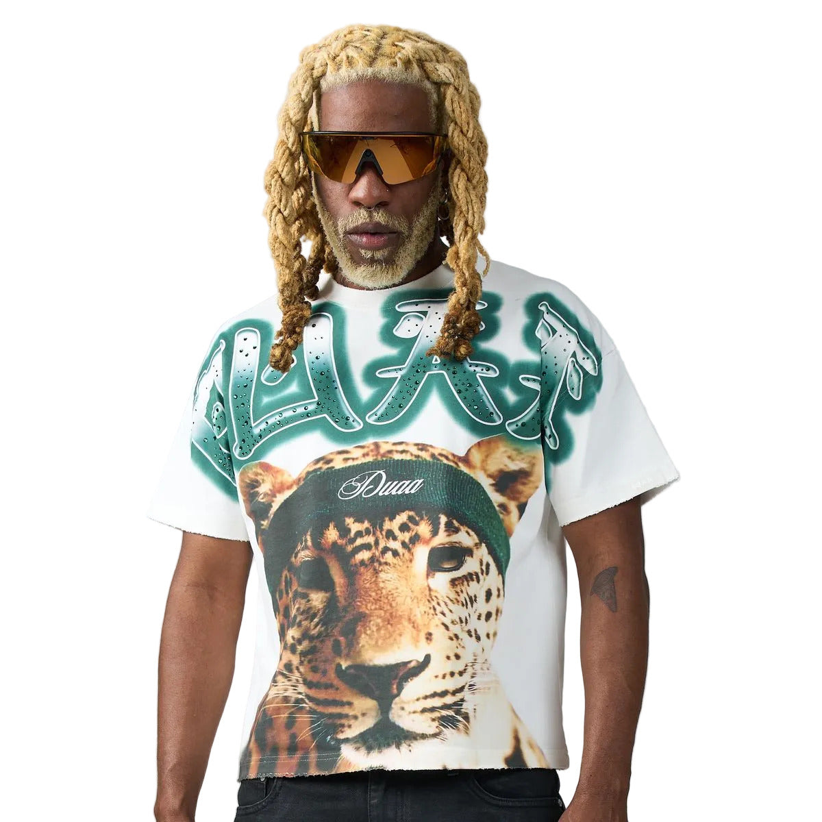 DUAA Bolt Tee in white featuring an airbrushed leopard graphic, teal rhinestone graffiti lettering, and a teal DUAA back print.
