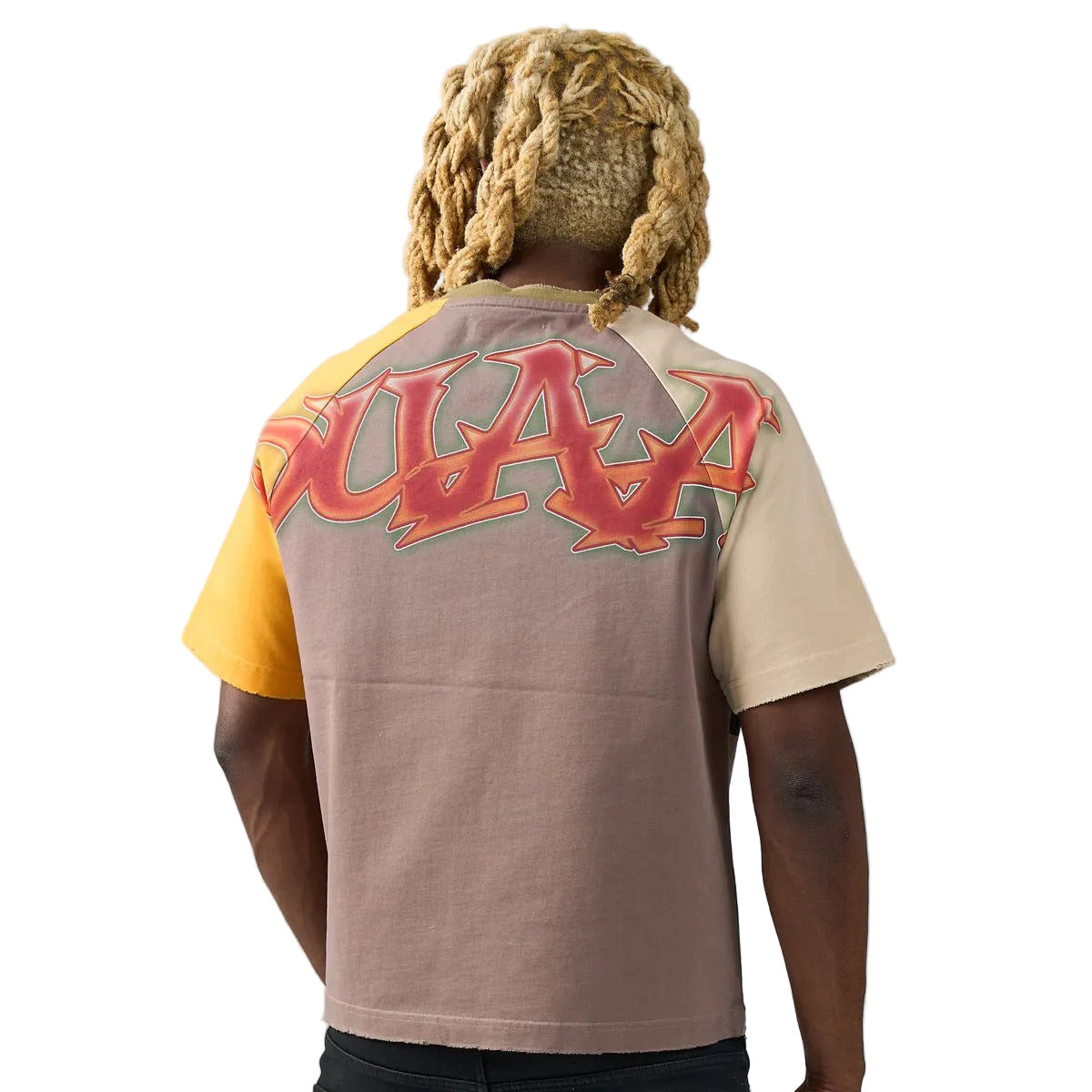 Tan raglan T-shirt with yellow and mauve sleeves, Statue of Liberty front graphic, rhinestone DUAA flame lettering, and DUAA graffiti back print.