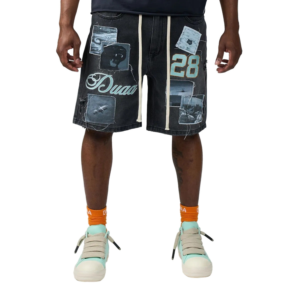 DUAA Movie Blue denim shorts in a black wash with collage photo print patches, DUAA script and number 28 graphics, embroidered back pockets, and a drawstring waist.