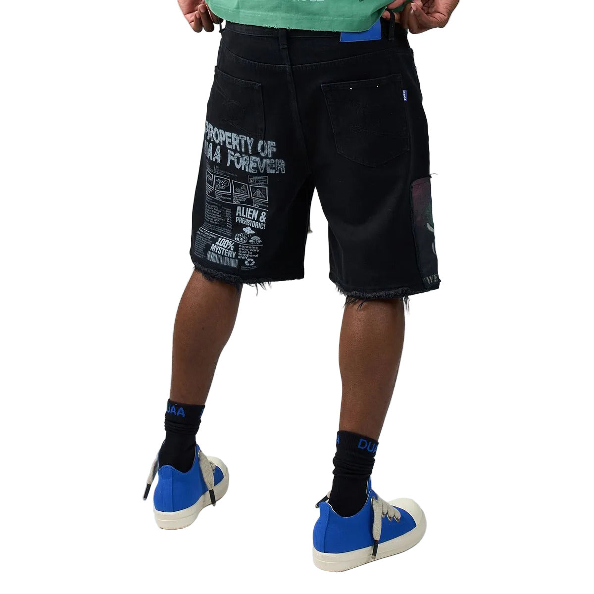 DUAA UFO Black denim shorts in a black colorway featuring an alien and UFO collage print, collegiate DUAA lettering with rhinestones, embroidered patches, and a drawstring waist.
