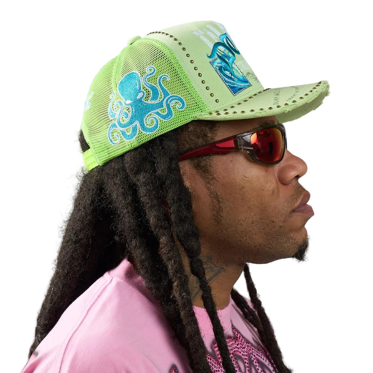DUAA Wave Hat with neon green front, mesh back, Old English embroidery, blue octopus side detail, gold stud trim, and distressed snapback brim.