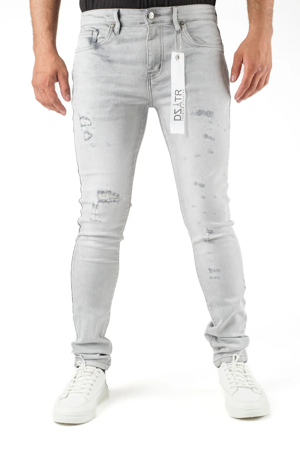 Light gray distressed jeans with a brand tag on a white background