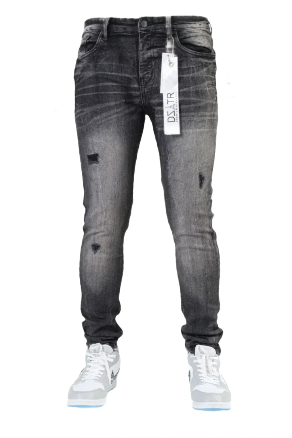 Gray distressed jeans with a brand tag on a white background