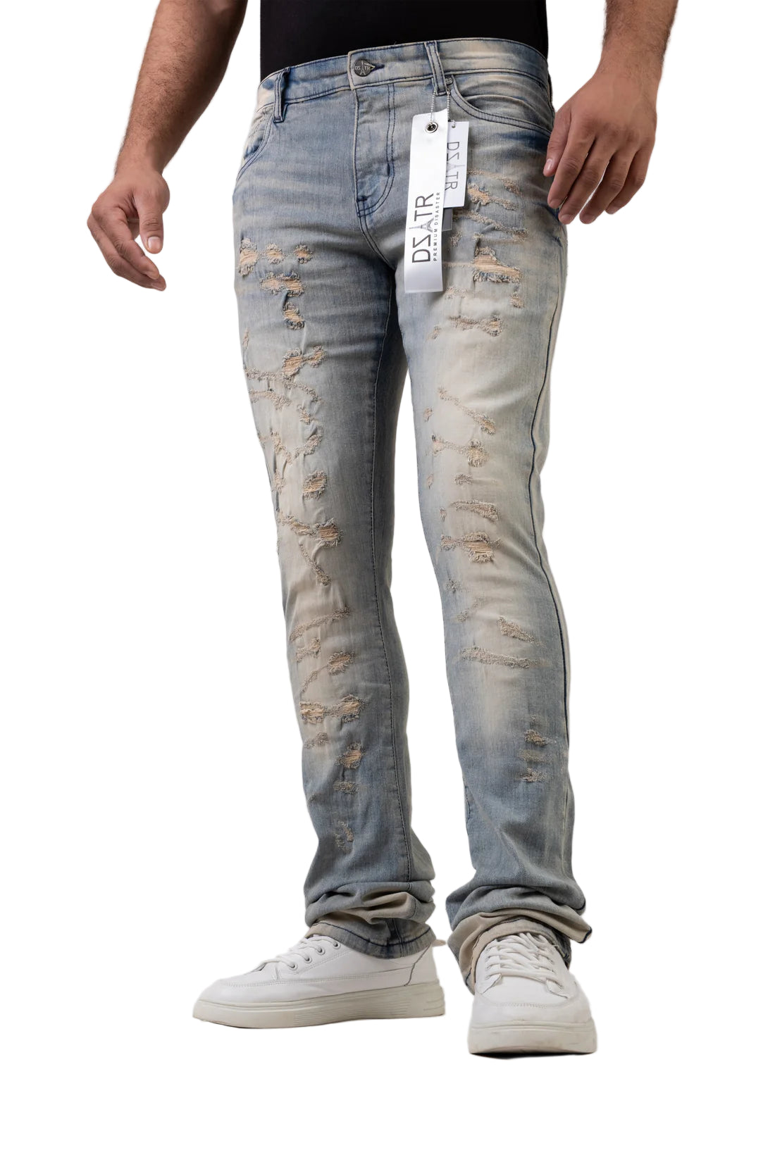 Distressed blue jeans with a brand tag on a white background