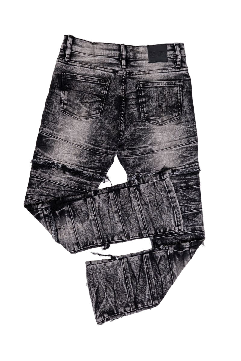 Jet black kids stacked jeans with 3D textured design and ultra-stretch fabric.