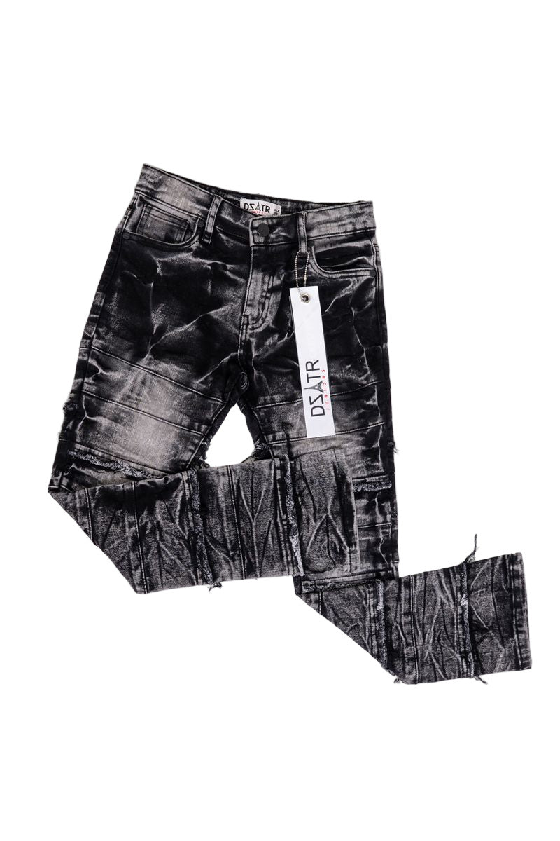 Black distressed jeans with a visible brand label on a white background