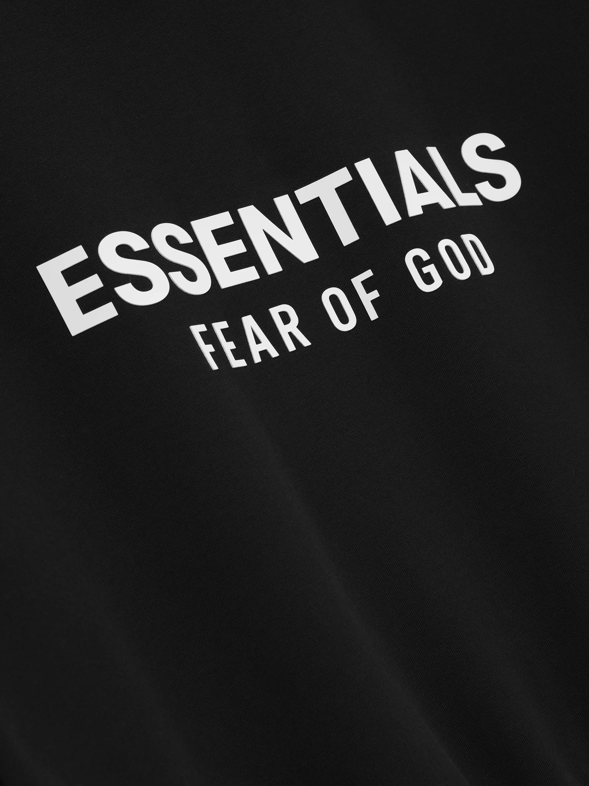 The Classic Crewneck Sweatshirt is made in heavy 380gsm core fleece to provide ideal comfort and structure. The signature "Essentials Fear of God" soft-touch logo is branded across the back. Details include a rib-knit collar, cuffs, and waist-hem. An updated Fear of God Essentials translucent rubberized label is stitched on the cuff.