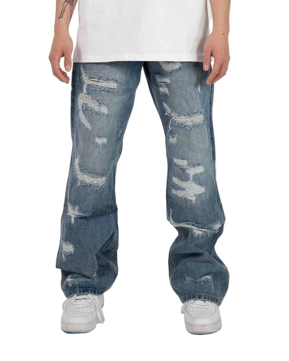 Wide fit heavyweight denim jeans with distressed details, repaired patches, and contrast cotton backing