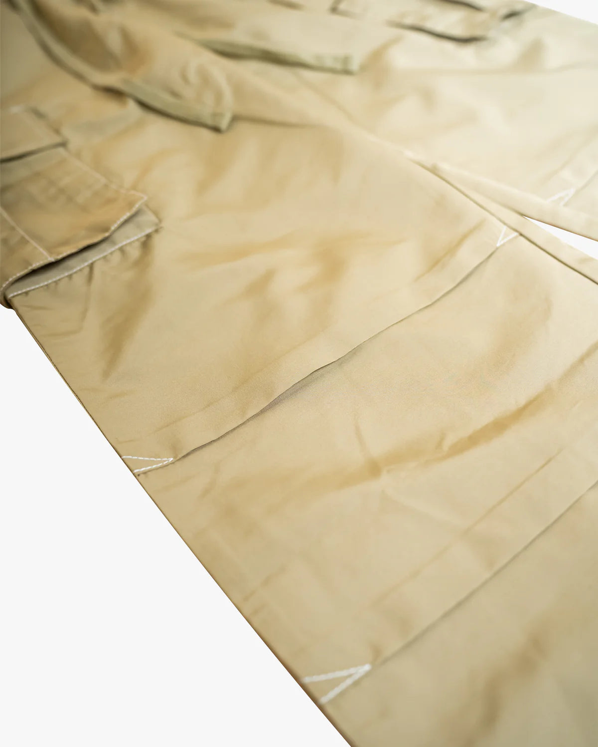 Campus Cargo Pants in nylon with relaxed fit, side cargo pockets, front knee pleating, and contrast white stitching