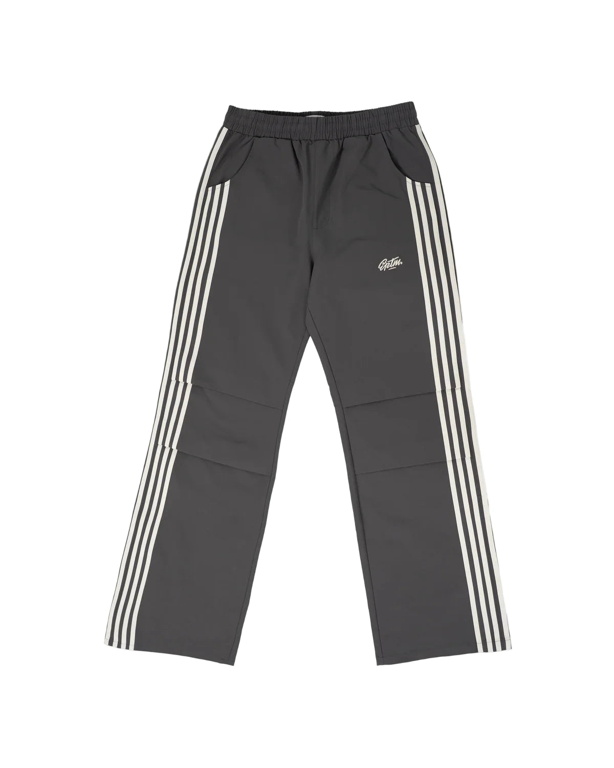 The Fogami Pants elevate everyday fashion basics with a relaxed flare silhouette, featuring bold side stripes that fold into front knee pleats for a subtle yet distinctive detail. Crafted from 100% polyester, they include an elastic waistband with an elongated interior drawcord for adjustable comfort. Additional features include side and back pockets and an embroidered logo for a polished streetwear finish.
