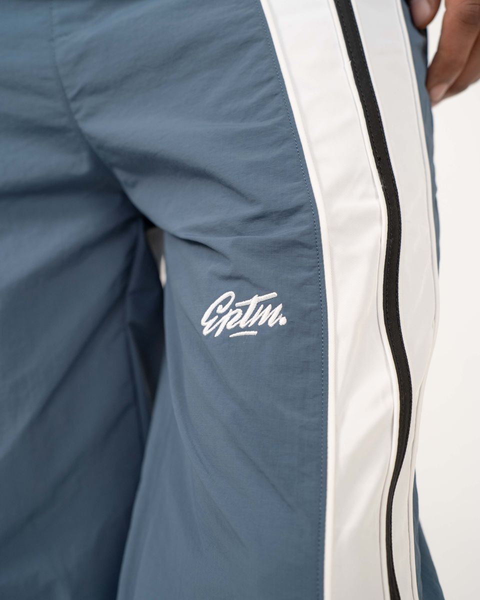 EPTM Catalina pants with bold color-block design, piping details, and lightweight nylon ripstop fabric for modern streetwear style