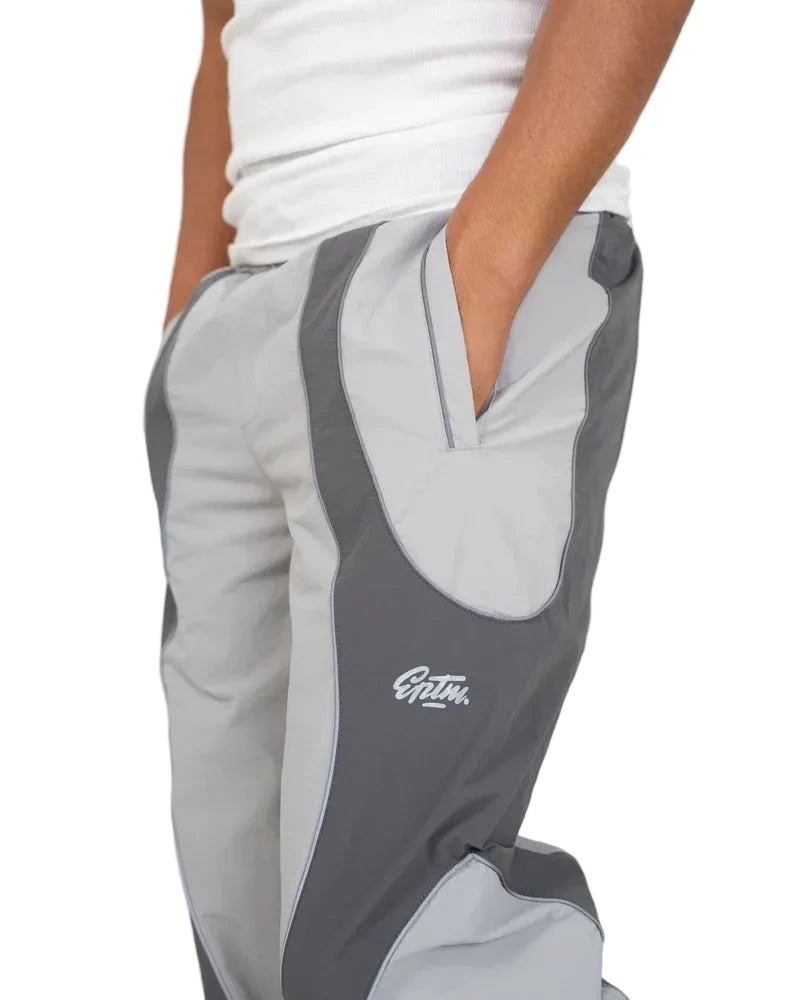 EPTM Era Pants in grey made from nylon ripstop with 3M reflective piping, elastic waistband, and relaxed fit