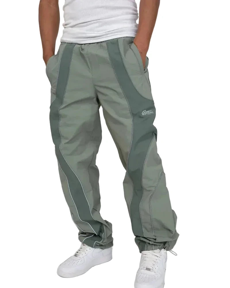 EPTM Era Pants in sage made from nylon ripstop with 3M reflective piping, elastic waistband, and relaxed fit