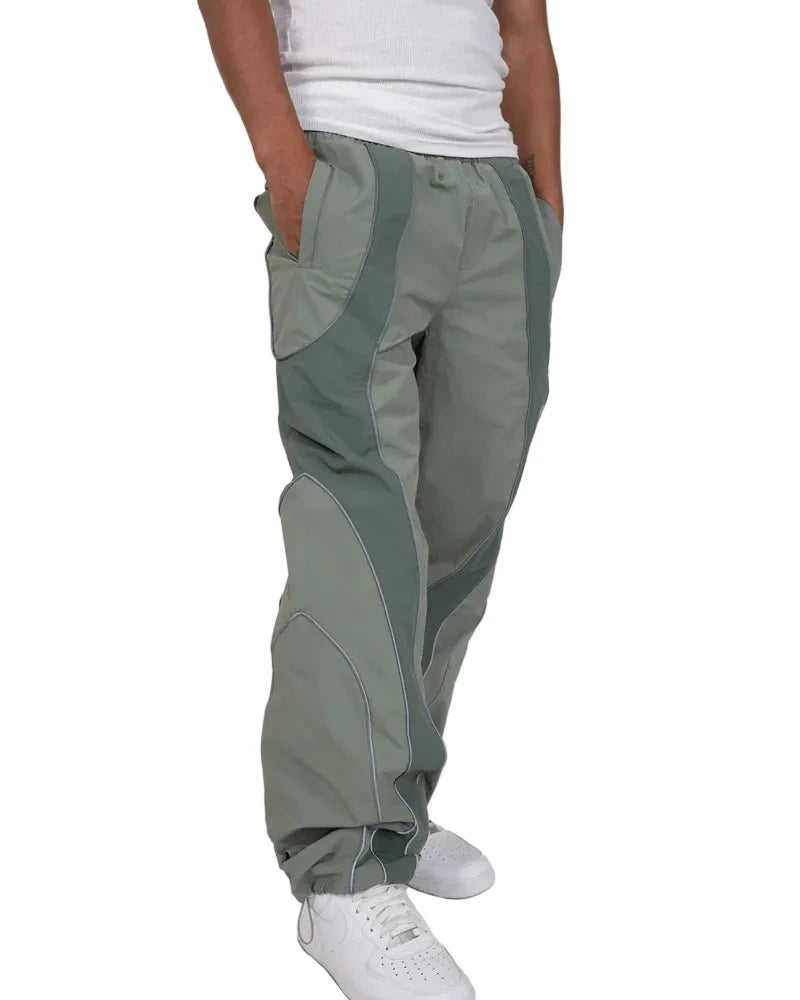 EPTM Era Pants in sage made from nylon ripstop with 3M reflective piping, elastic waistband, and relaxed fit