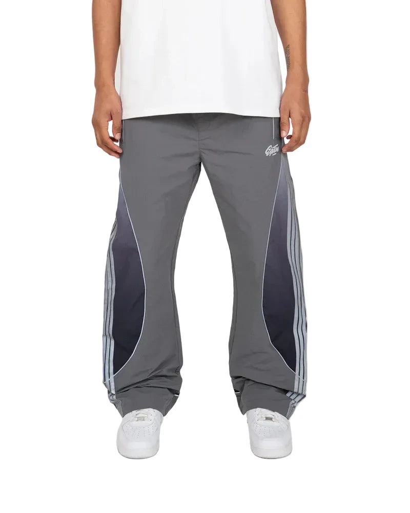 Solar Pants made from ripstop nylon with sun-inspired ombre panels, 3M reflective trims, elastic waistband, and relaxed fit