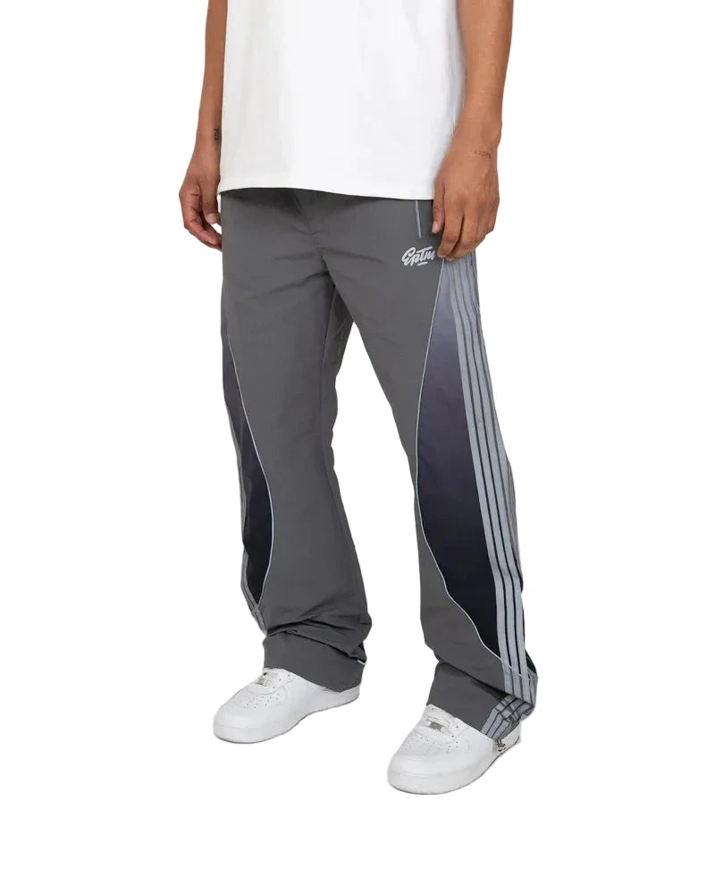 Solar Pants made from ripstop nylon with sun-inspired ombre panels, 3M reflective trims, elastic waistband, and relaxed fit