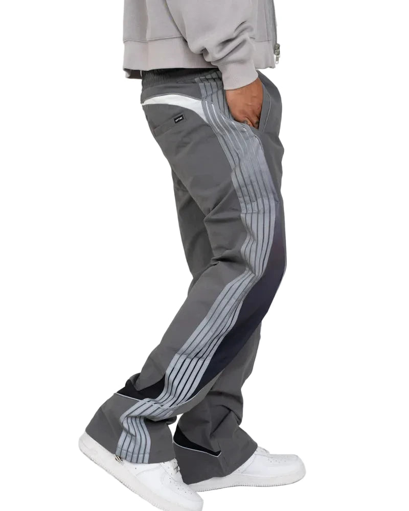 Solar Pants made from ripstop nylon with sun-inspired ombre panels, 3M reflective trims, elastic waistband, and relaxed fit