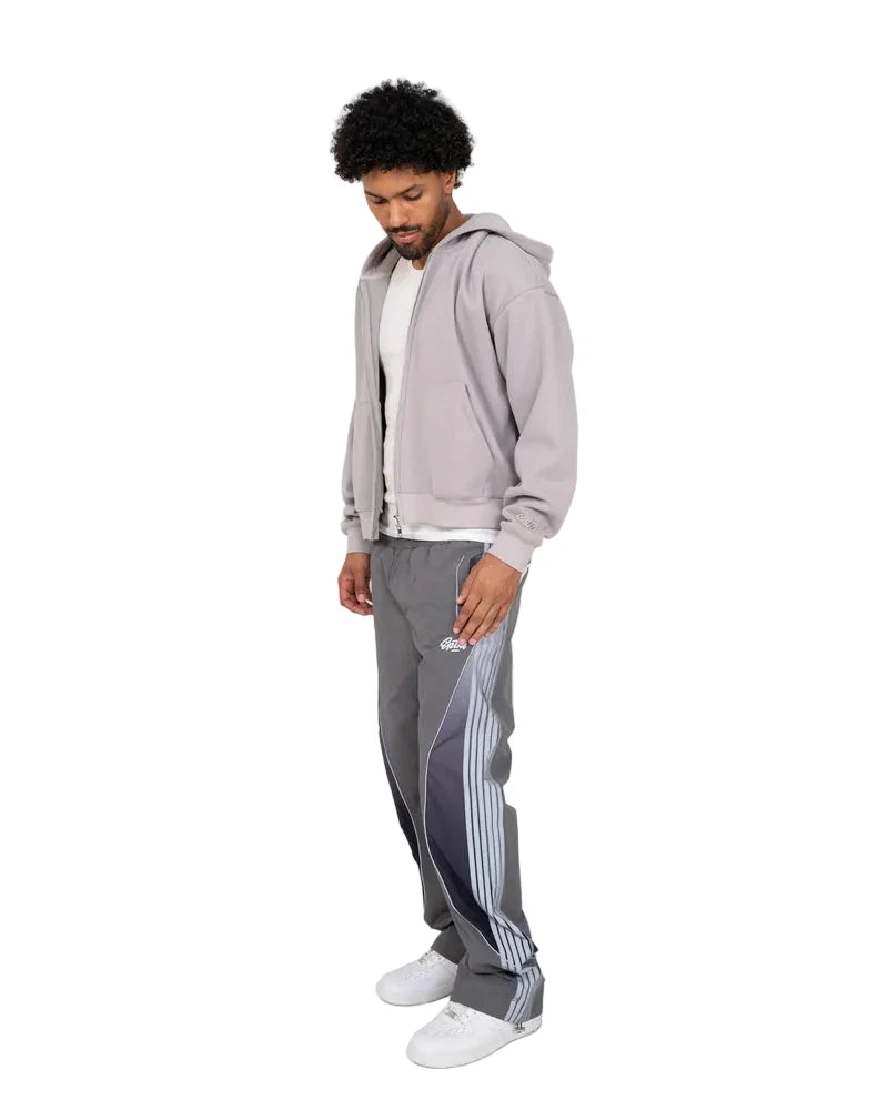 Solar Pants made from ripstop nylon with sun-inspired ombre panels, 3M reflective trims, elastic waistband, and relaxed fit