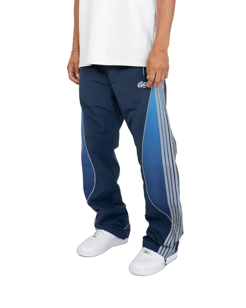 EPTM Solar Pants in Dusk made from ripstop nylon with sun-inspired ombre panels, 3M reflective trims, elastic waistband, and relaxed fit