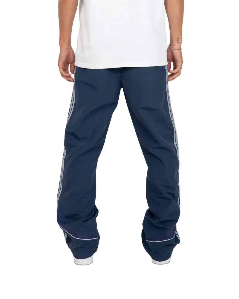 EPTM Solar Pants in Dusk made from ripstop nylon with sun-inspired ombre panels, 3M reflective trims, elastic waistband, and relaxed fit