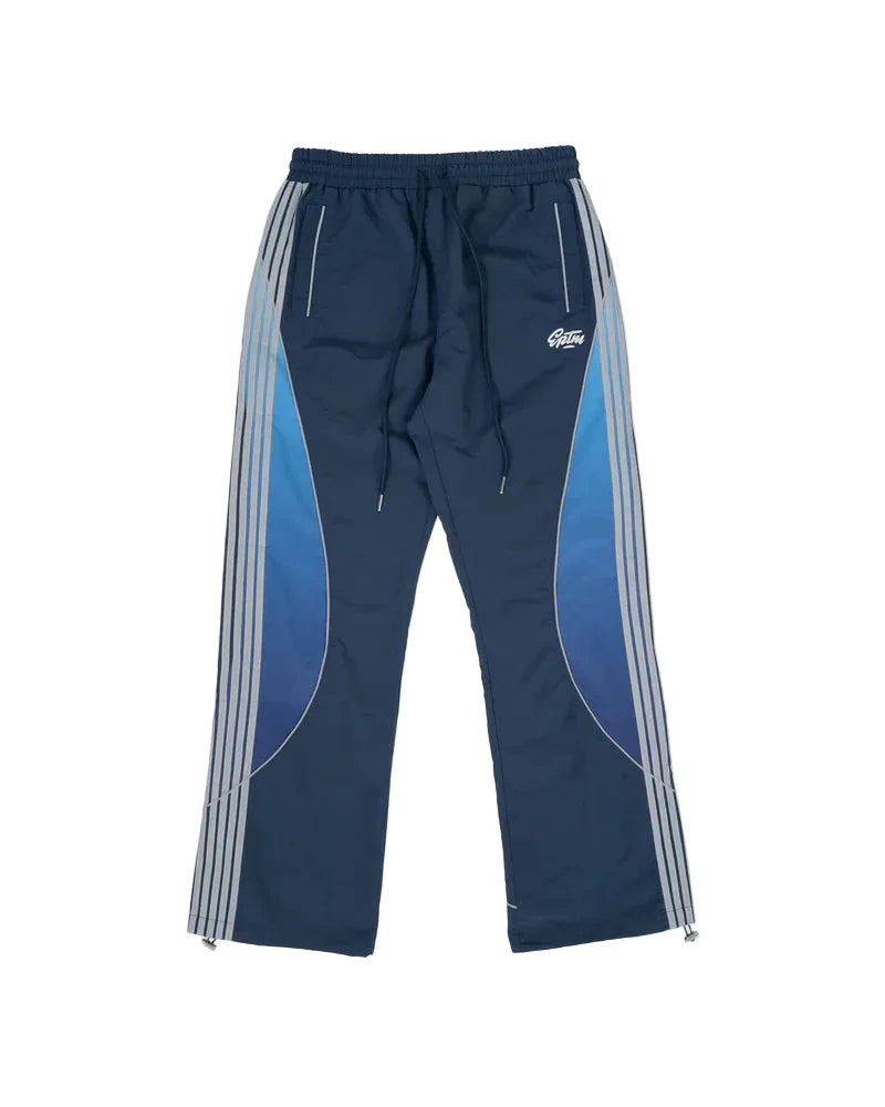 EPTM Solar Pants in Dusk made from ripstop nylon with sun-inspired ombre panels, 3M reflective trims, elastic waistband, and relaxed fit