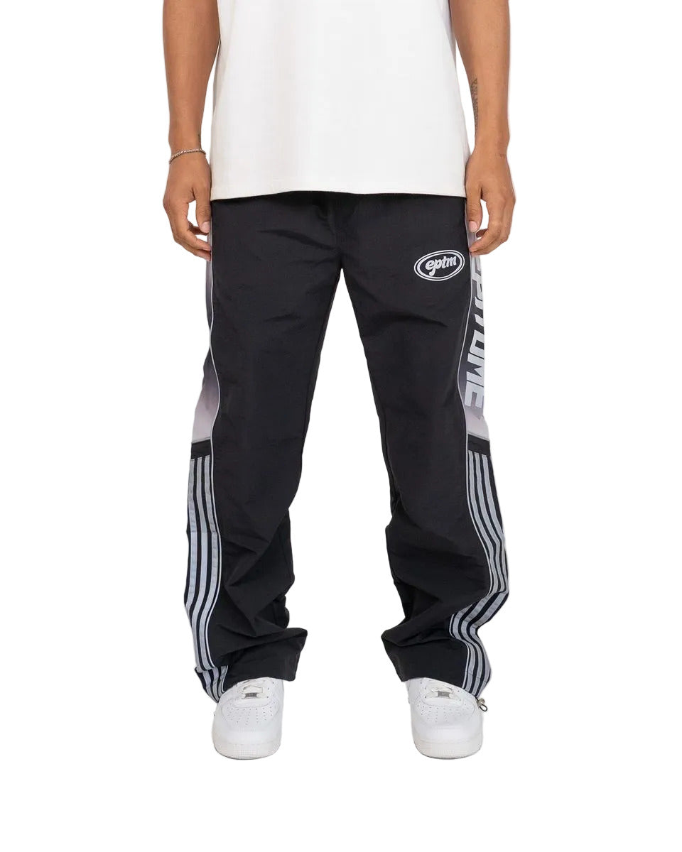 Eclipse pants with ripstop nylon construction, ombre panels, reflective 3M accents, elastic waistband with drawstring, and adjustable bottom toggles