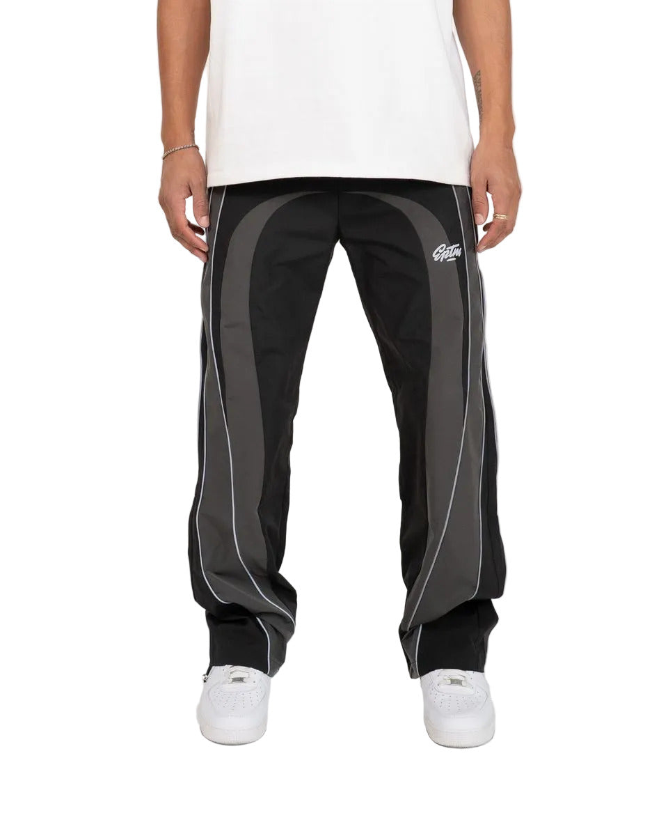 EPTM UO black pants with nylon fabric, 3M reflective piping, elastic drawstring waistband, adjustable bottom toggles, and front welt pockets