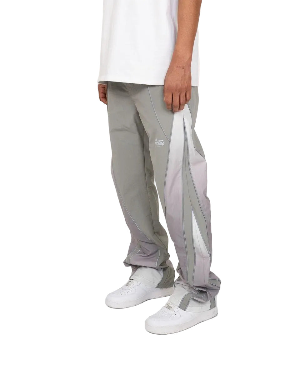 Laguna pants with ombré contrast panels, reflective piping, relaxed flare fit, and modern streetwear styling