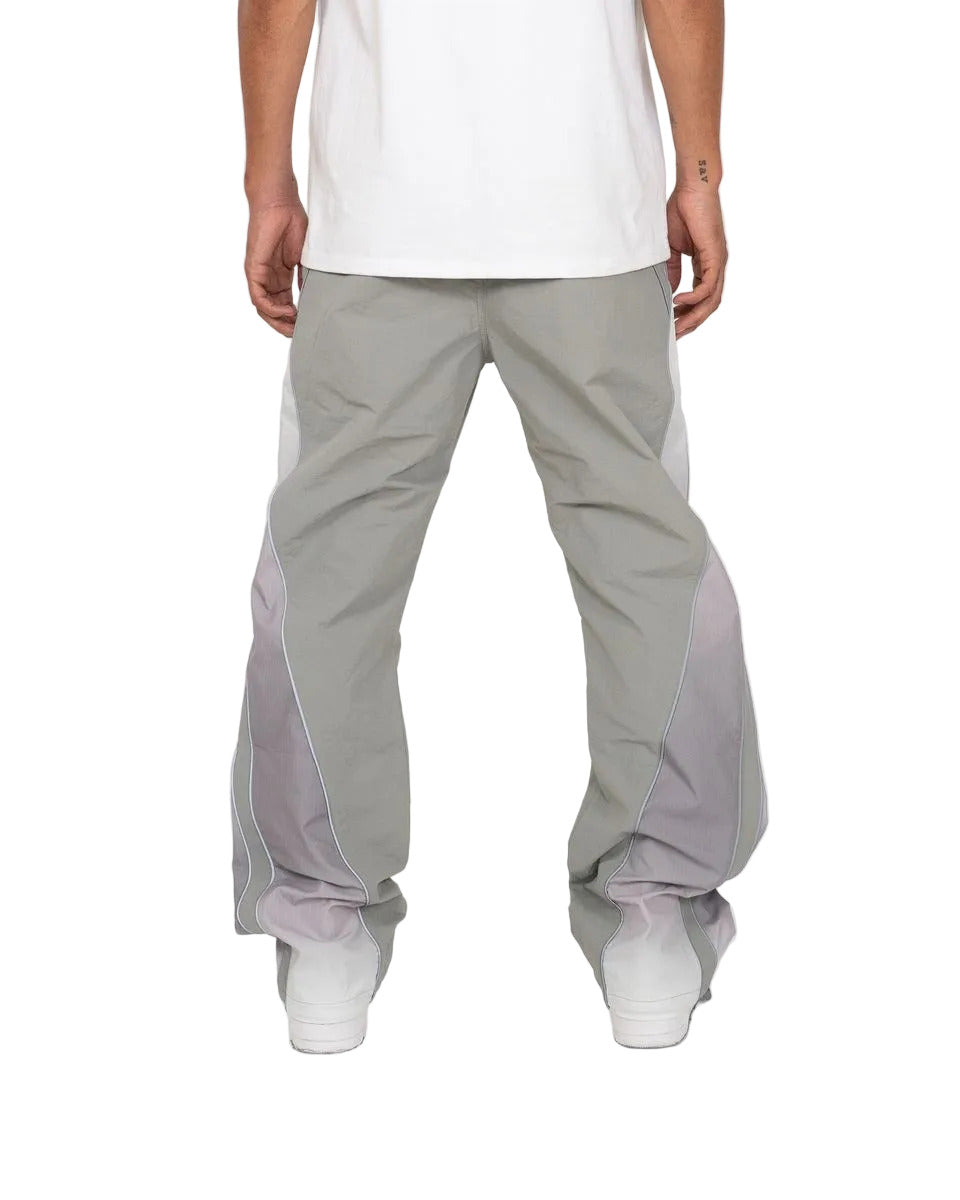 Laguna pants with ombré contrast panels, reflective piping, relaxed flare fit, and modern streetwear styling