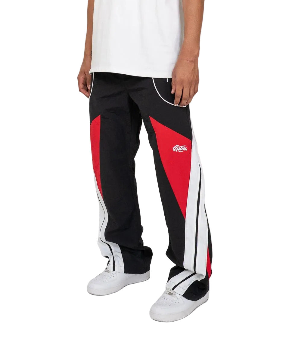 Noir pants with color-block panels, piping details, and lightweight nylon ripstop fabric for modern streetwear style