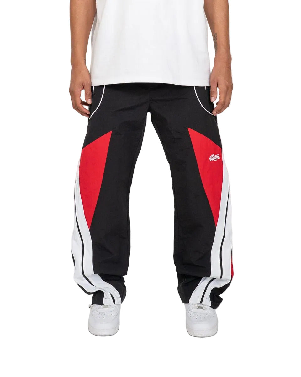 Noir pants with color-block panels, piping details, and lightweight nylon ripstop fabric for modern streetwear style