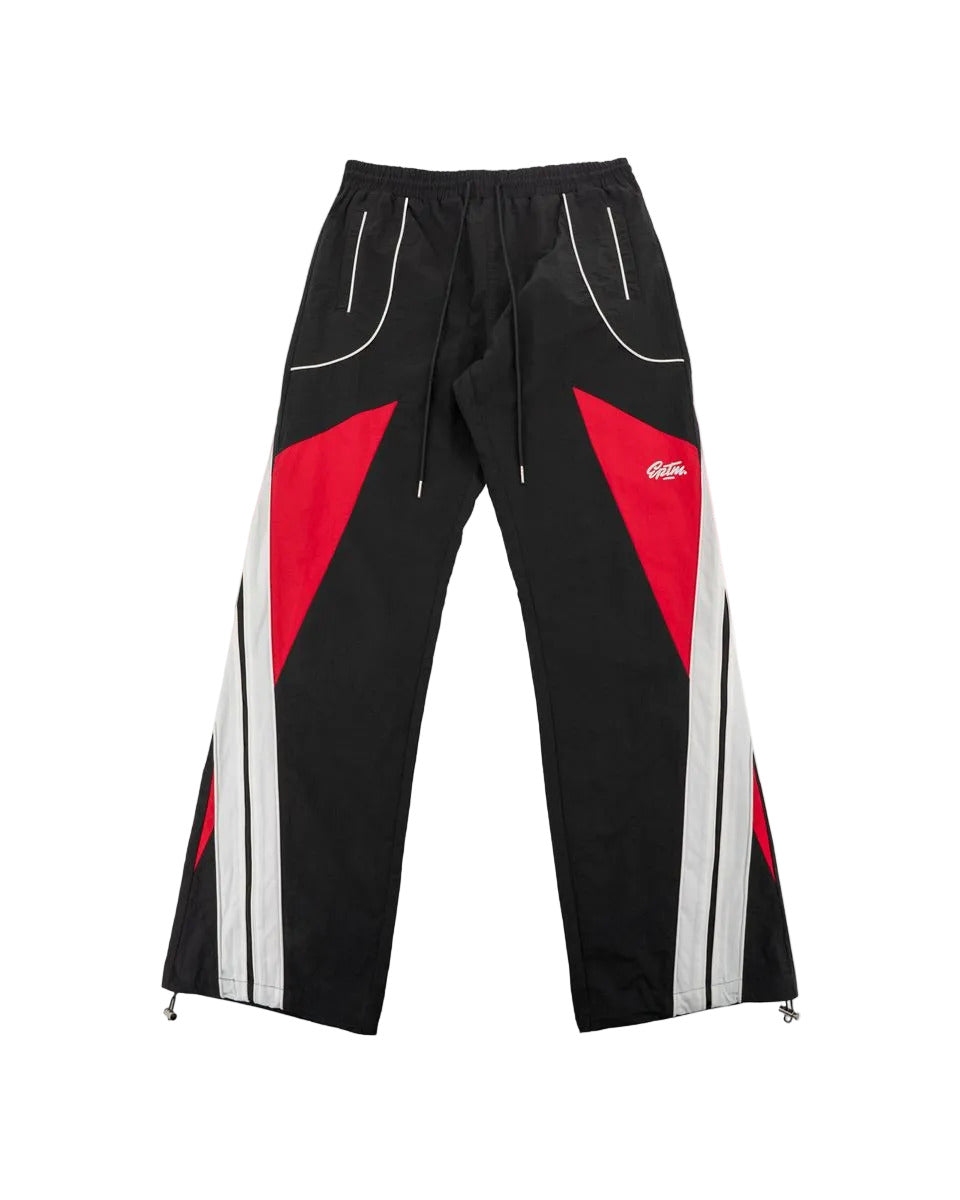Noir pants with color-block panels, piping details, and lightweight nylon ripstop fabric for modern streetwear style