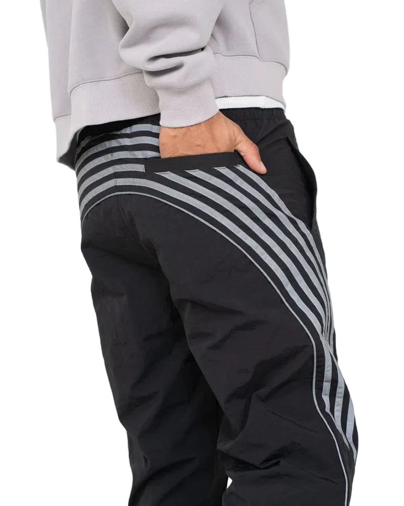 EPTM Roundy Pants with striped leg detailing, lightweight fabric, and modern athletic streetwear design