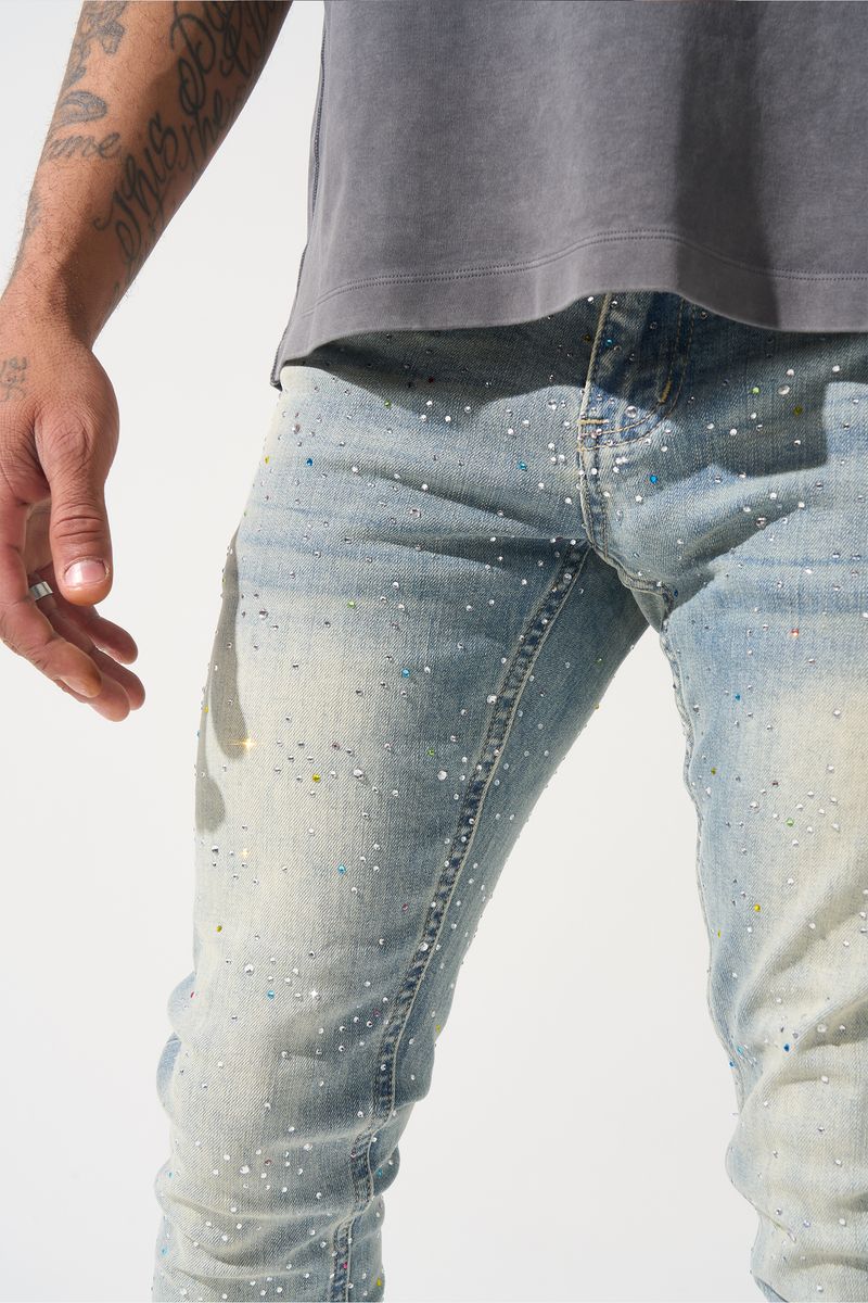 SERENEDE® Franchise fitted denim jeans in vintage earth blue wash with multi-colored hot-fix crystals and branded detailing.